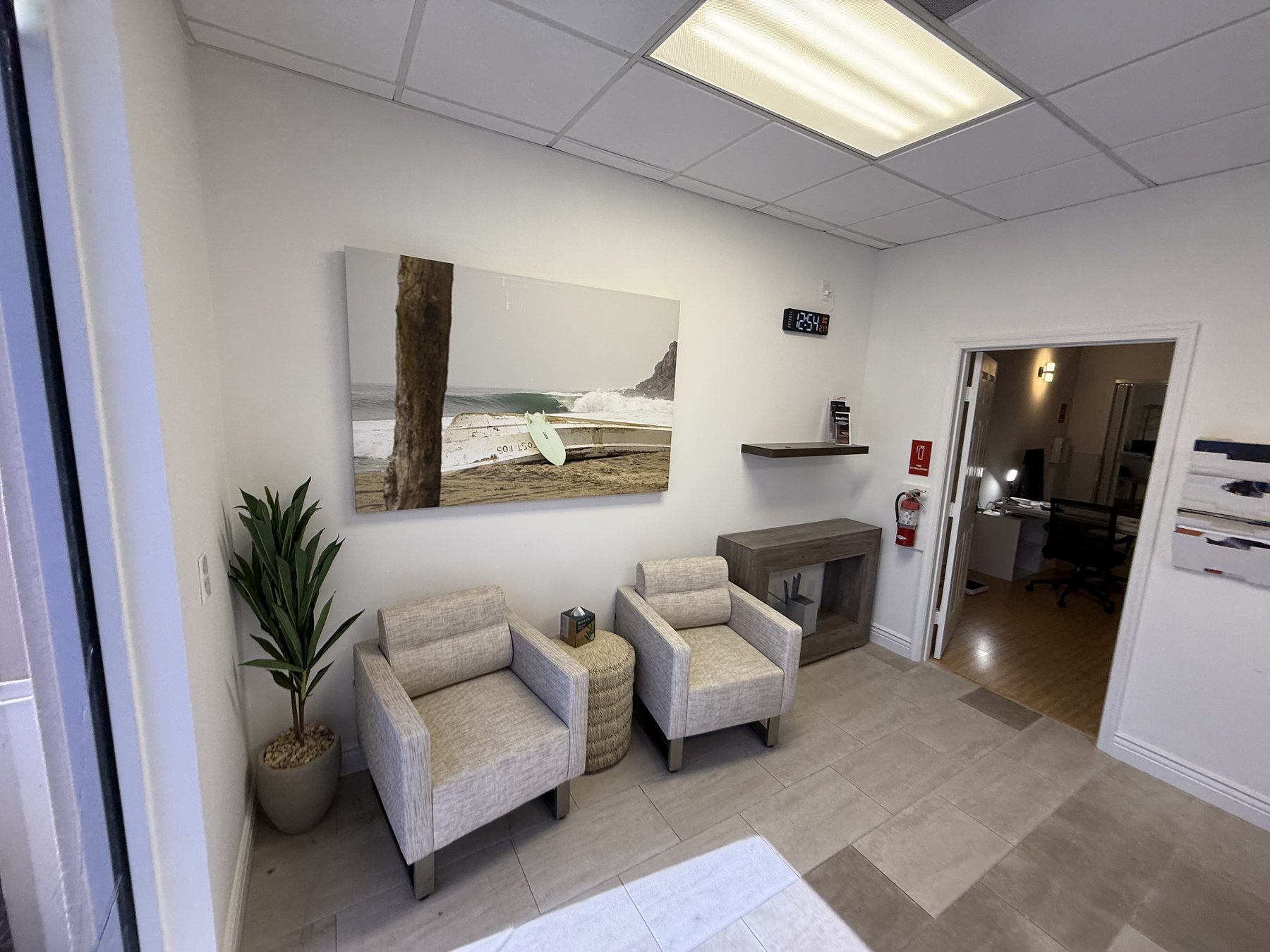 Med2Bio waiting lounge with beach art and seating