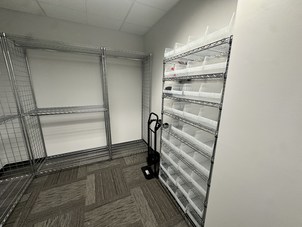 Small item storage unit with 32 clear bins