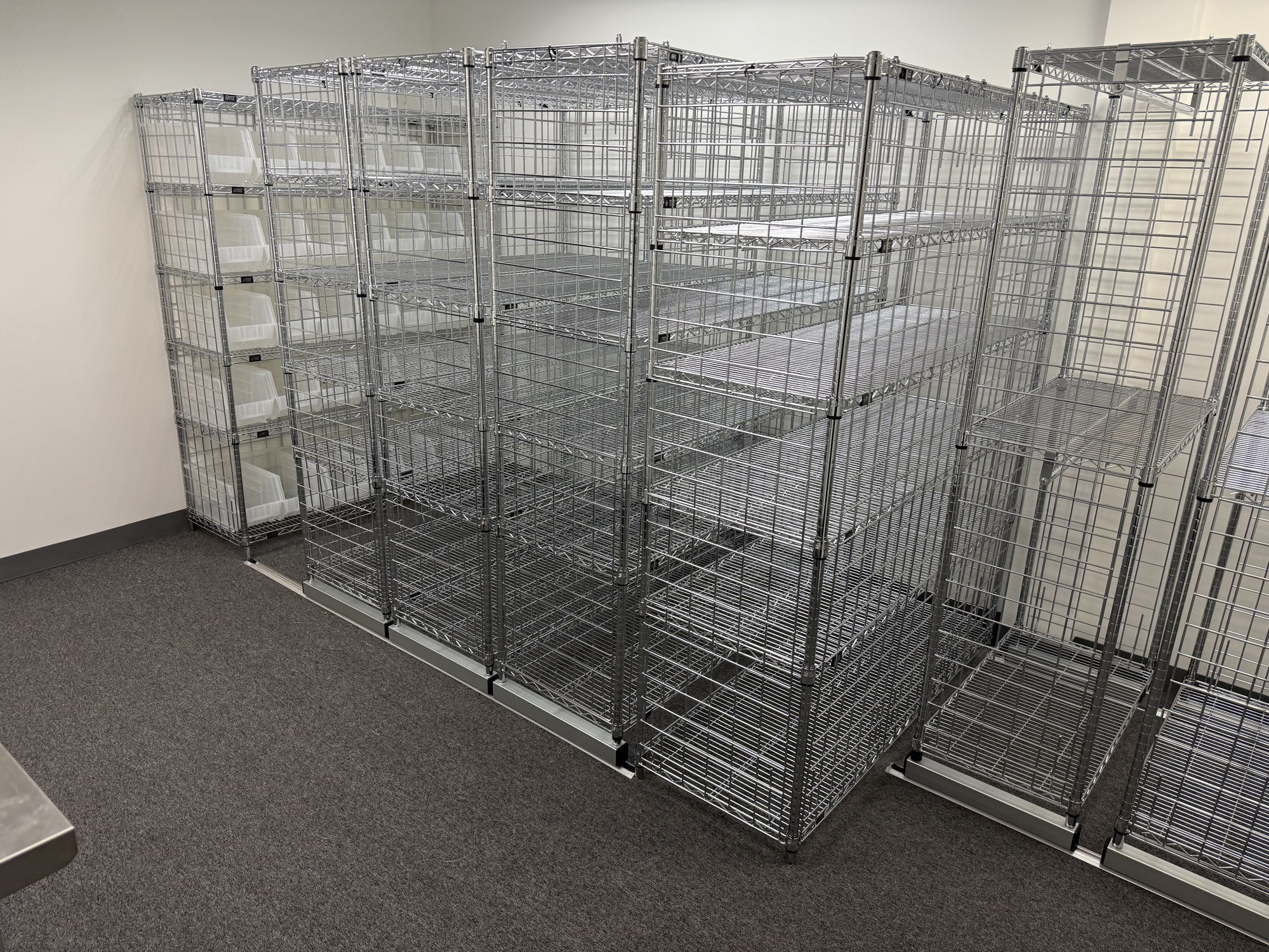 Close-up of six-tier cubby racks with storage bins