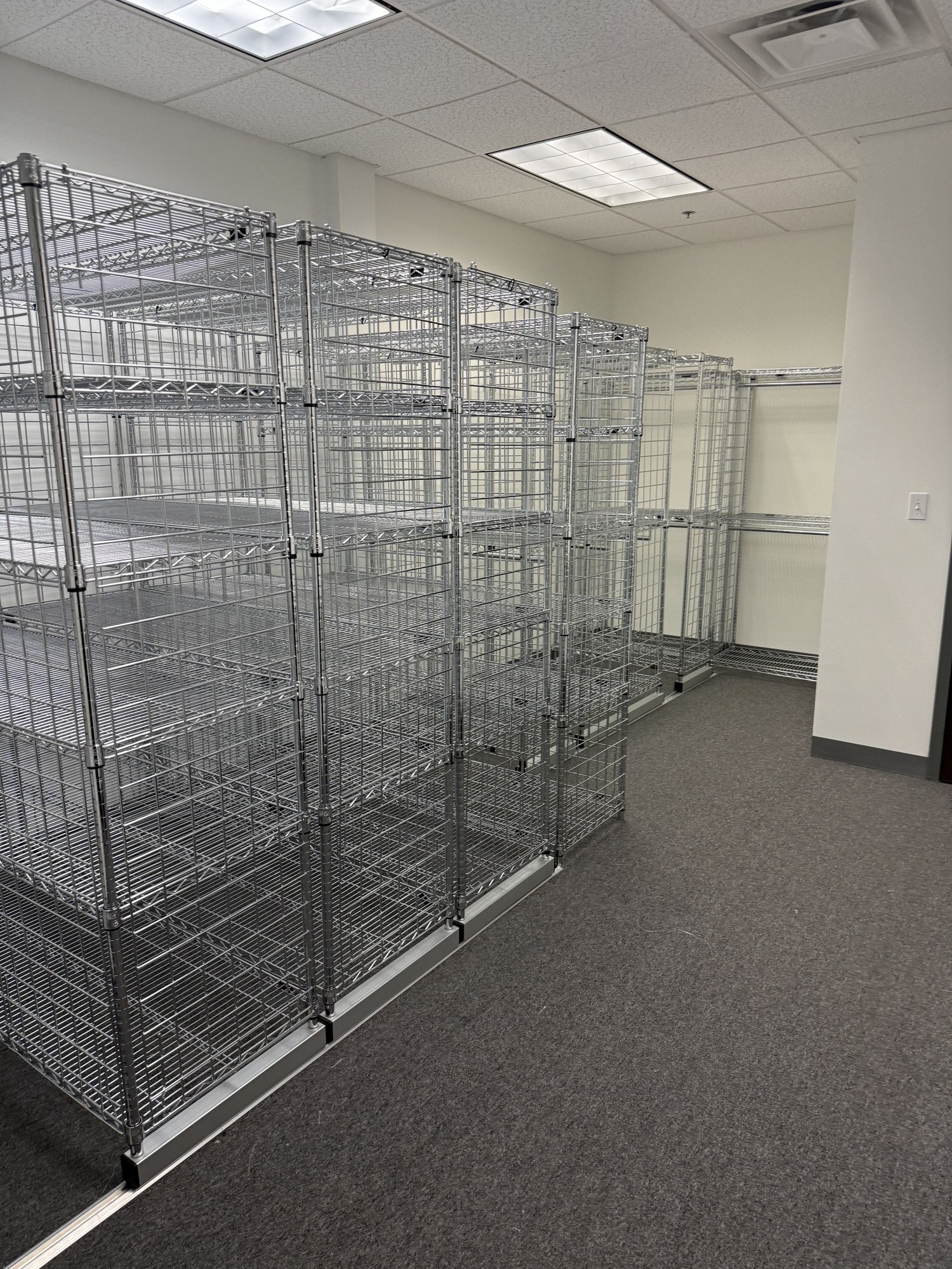 Row of chrome cubby racks installed along wall