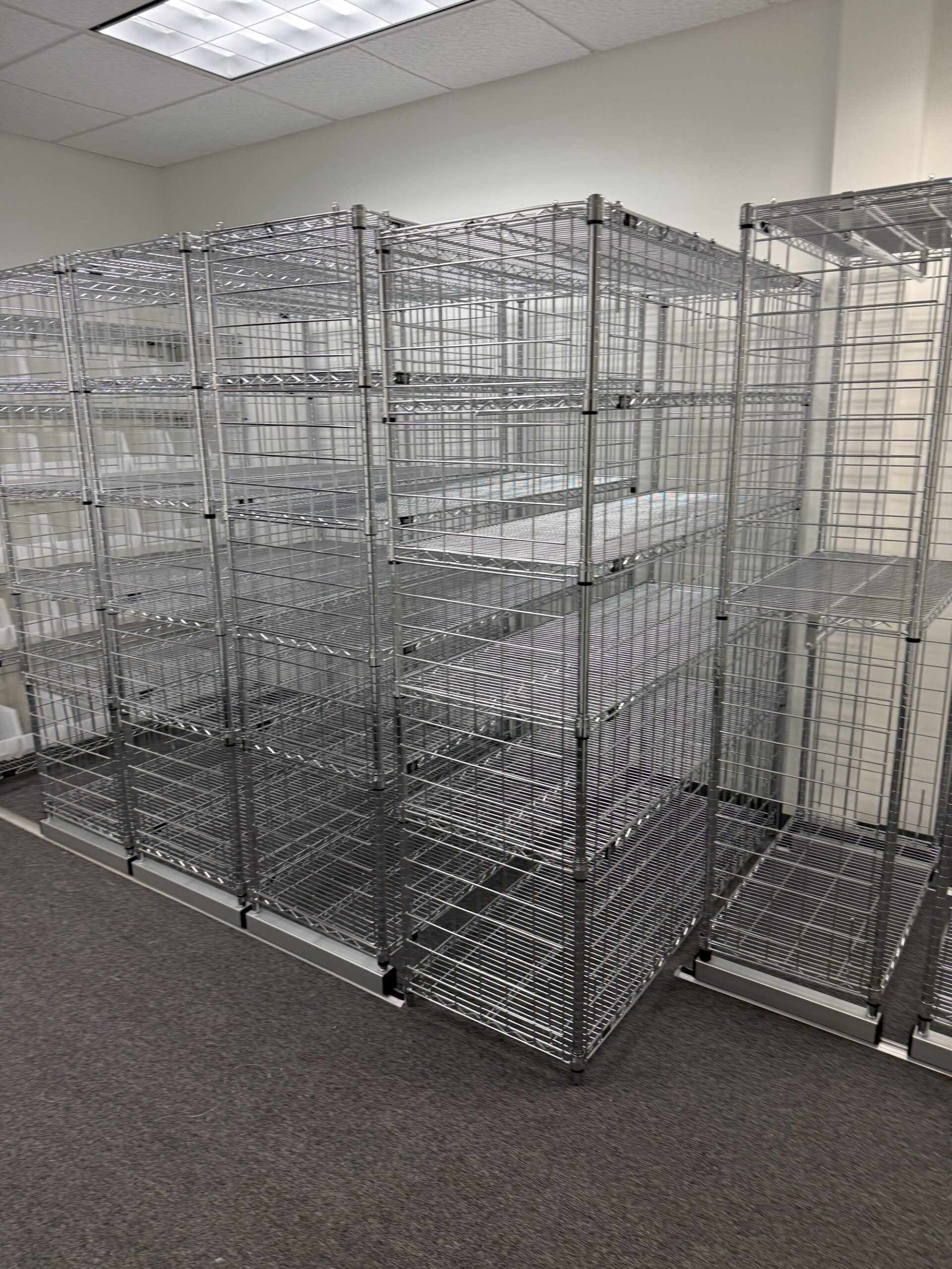 Wilmington uniform room full shelving overview with cubby racks and garment racks
