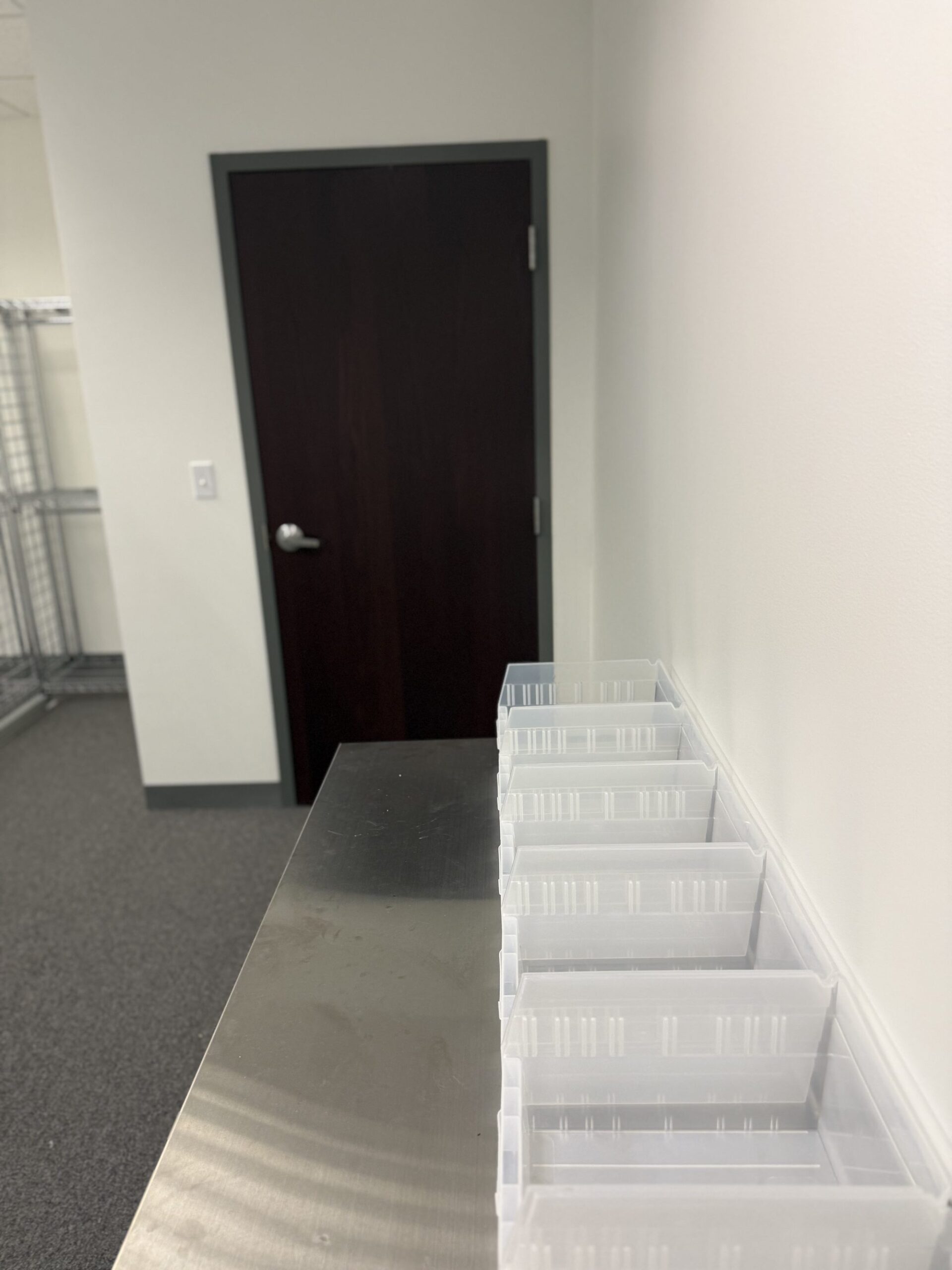 Stainless steel work table with storage bins and undershelf